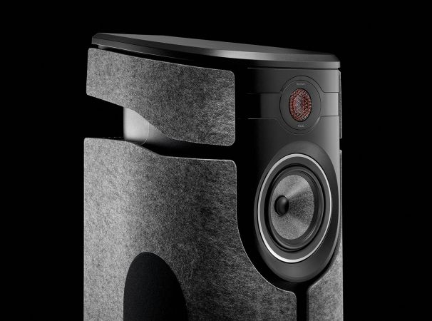 Close-up of a premium speaker with visible tweeter and midrange driver against a black background